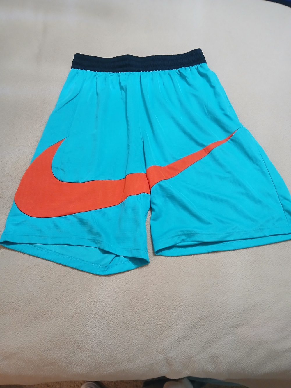 Nike Kids' Teal Athletic Shorts with Orange Swoosh